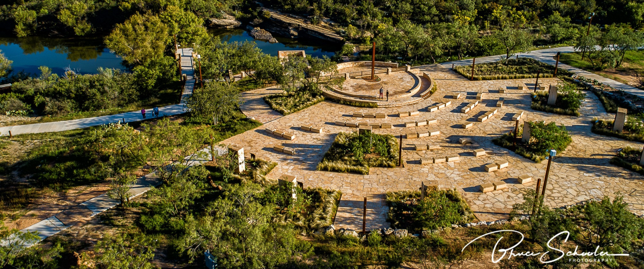 Overhead shot capturing the serene beauty of the Historic Spring in Big Spring, Texas, with its ston